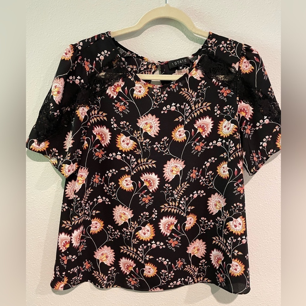 I State women’s black floral short sleeve top with lace inserts. Size M